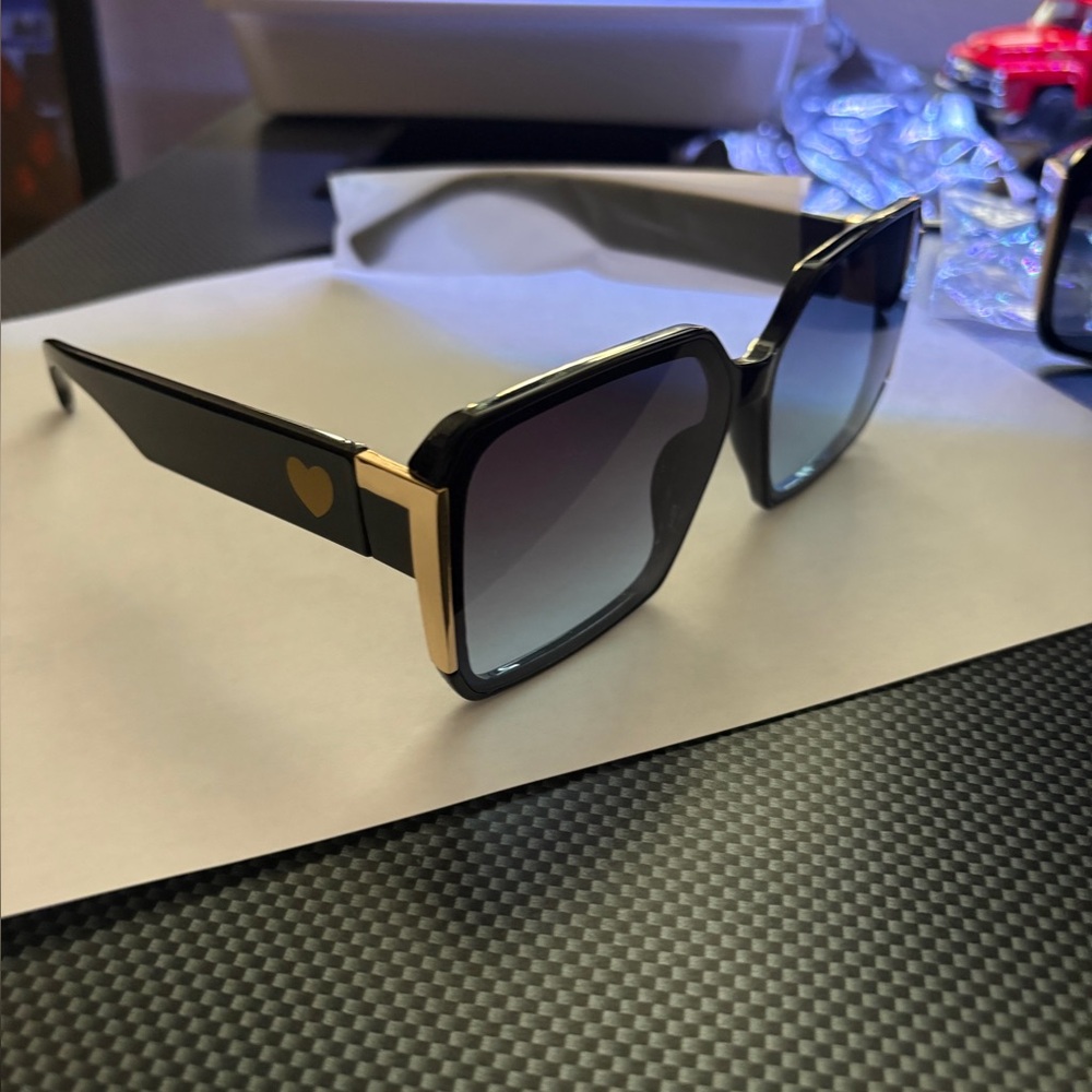 Stylish Black Sunglasses with Gold Accent